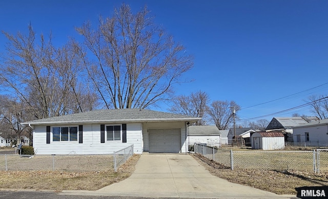 view of front of house with concrete driveway, an attached garage, and a fenced front yard