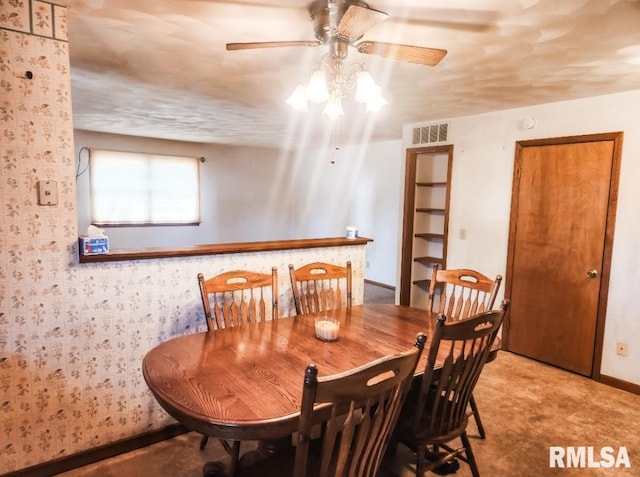 dining space with visible vents, ceiling fan, and baseboards