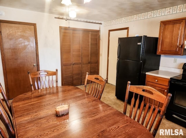 dining area featuring light colored carpet