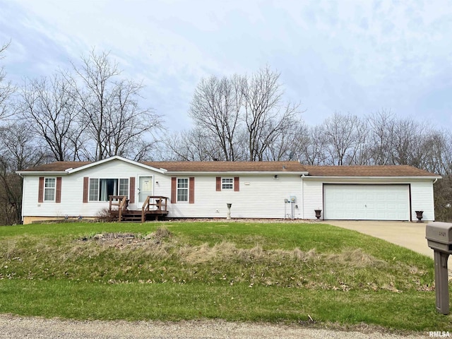 view of front of house featuring a garage and a front yard