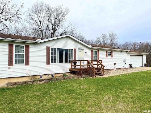 exterior space featuring a front yard, a garage, and a deck