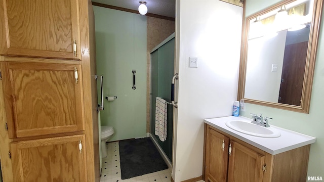 full bathroom with tile patterned floors, toilet, vanity, a shower stall, and ornamental molding