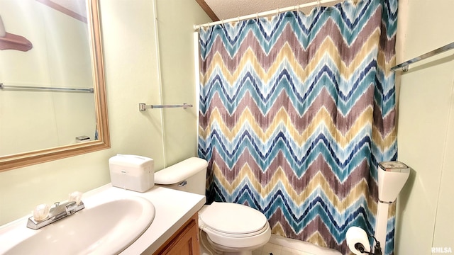 full bath featuring toilet, vanity, and curtained shower