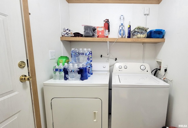 laundry room with washer and clothes dryer and laundry area