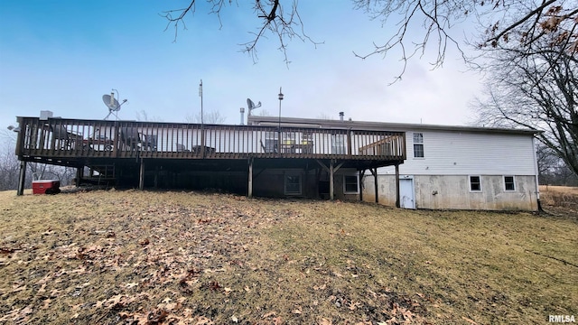 rear view of house featuring a deck