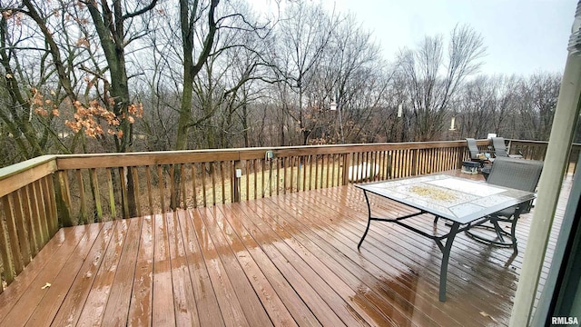wooden terrace featuring outdoor dining space
