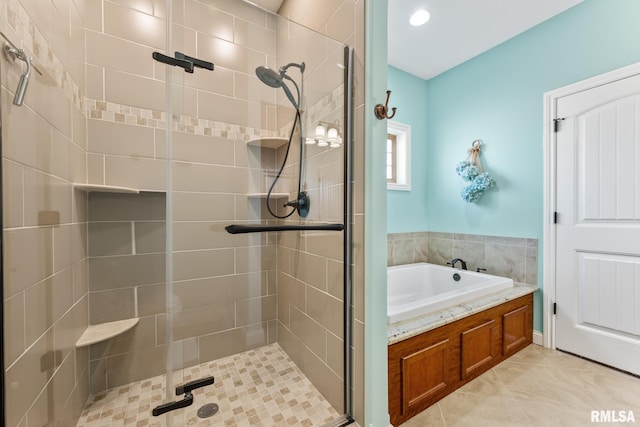 full bath featuring a shower stall, a bath, and tile patterned floors