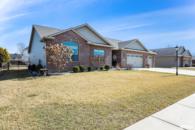 craftsman house featuring brick siding, a front lawn, fence, concrete driveway, and an attached garage