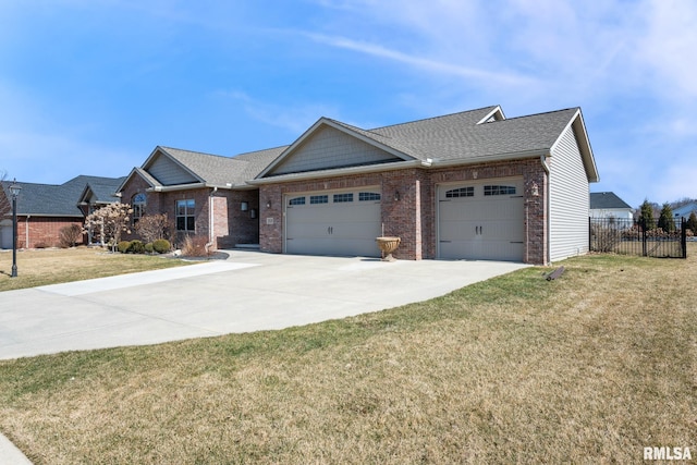 view of front facade featuring driveway, fence, a front yard, a garage, and brick siding