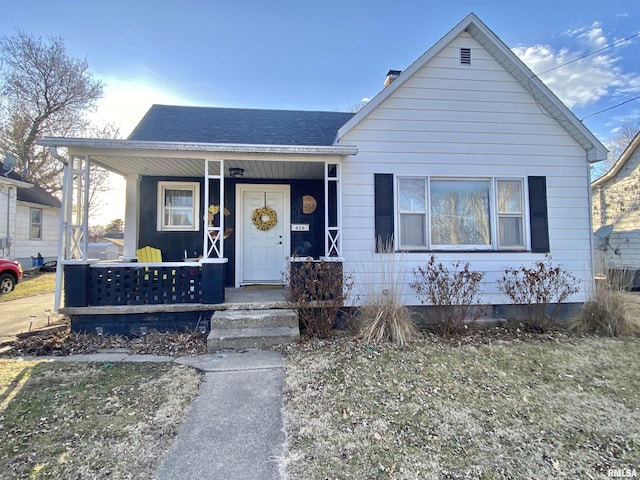 bungalow-style home with a porch, crawl space, and a shingled roof