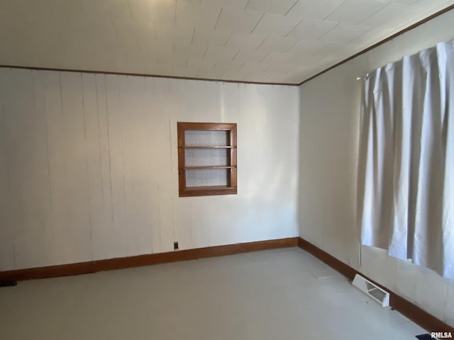 empty room featuring visible vents and baseboards