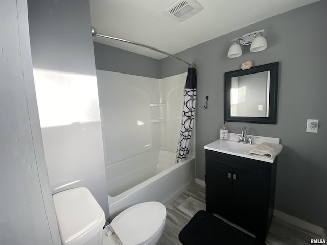 bathroom with toilet, vanity, baseboards, visible vents, and shower / bathtub combination with curtain