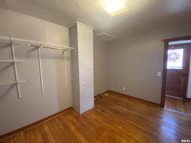 walk in closet featuring wood finished floors