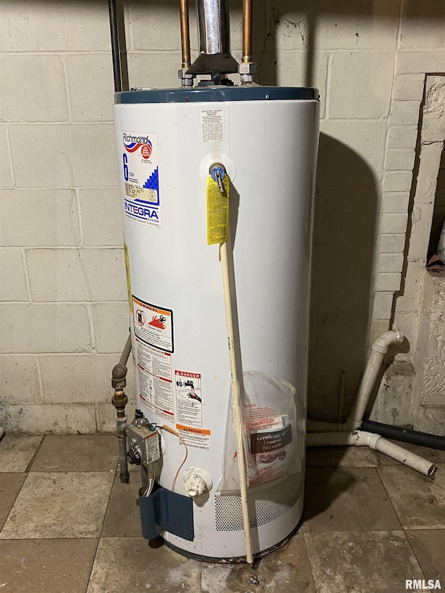 utility room featuring gas water heater