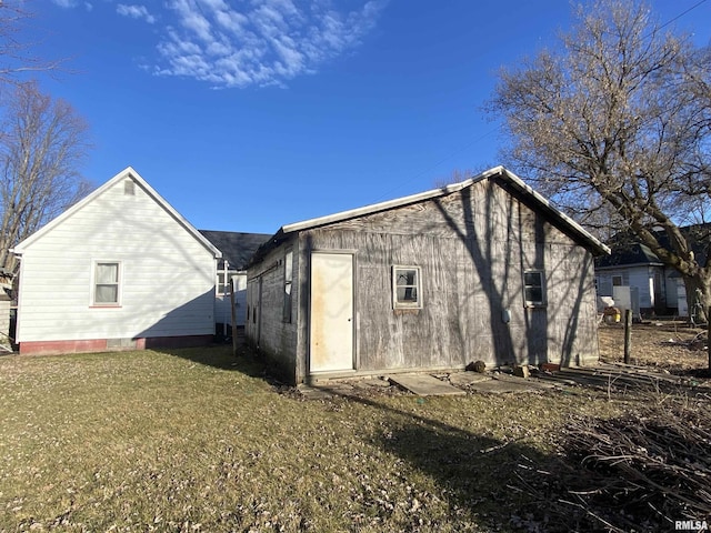 view of home's exterior with a yard