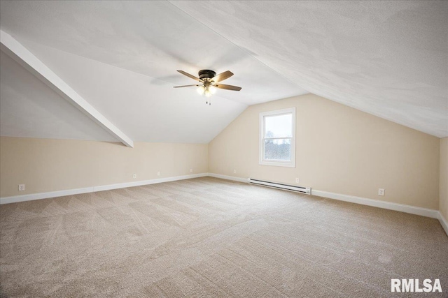 bonus room featuring carpet floors, a baseboard radiator, baseboards, and lofted ceiling