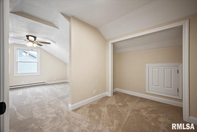 bonus room featuring lofted ceiling, baseboard heating, and carpet