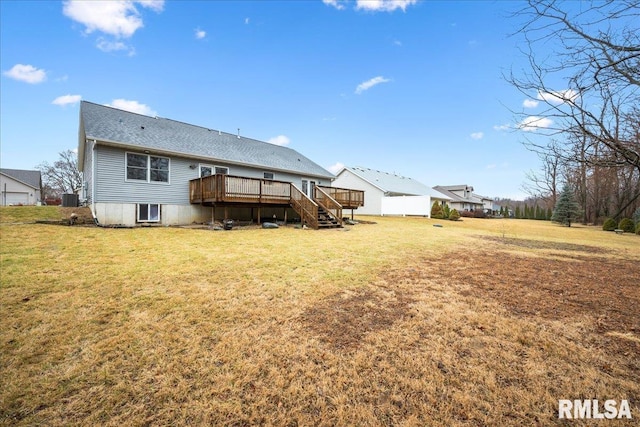 back of property with central AC unit, a lawn, and a wooden deck