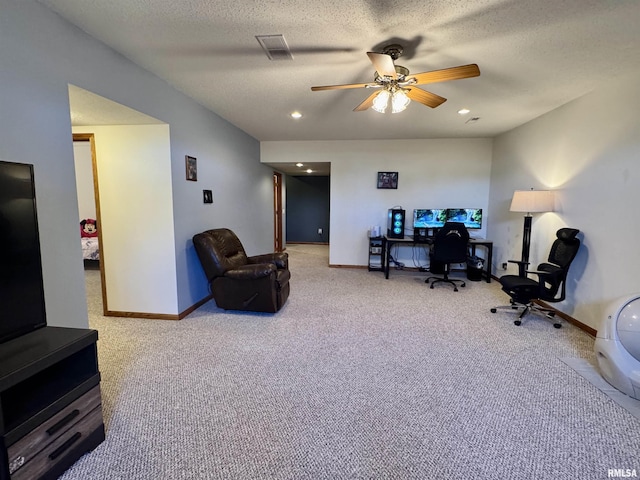 office area featuring baseboards, visible vents, ceiling fan, a textured ceiling, and carpet floors