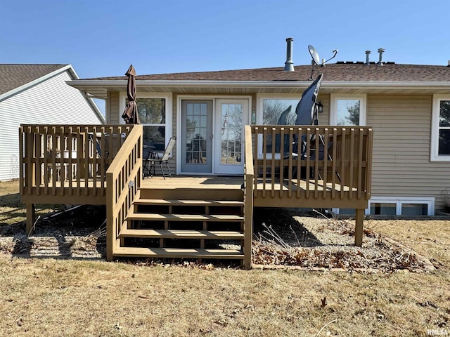 back of house with roof with shingles and a wooden deck