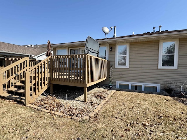 rear view of property featuring a deck