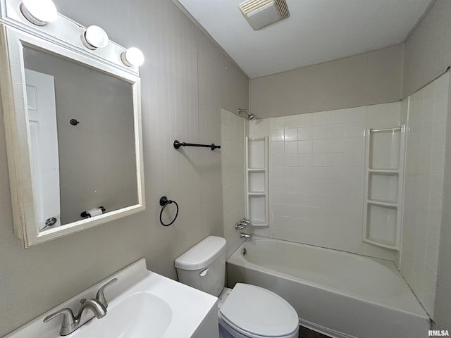 bathroom featuring visible vents, toilet, vanity, and  shower combination