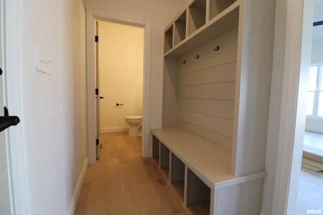 mudroom with light wood-type flooring and baseboards