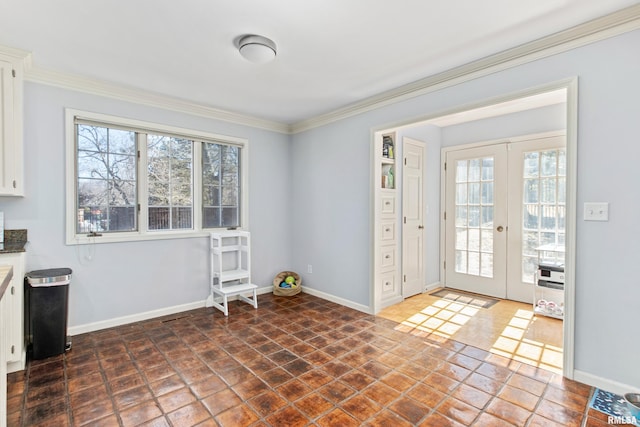 doorway to outside featuring french doors, baseboards, and ornamental molding