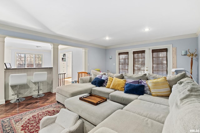 living room with recessed lighting, decorative columns, baseboards, and ornamental molding