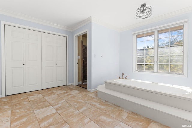 bathroom with crown molding, a garden tub, and baseboards