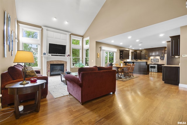 dining space with recessed lighting, baseboards, and light wood finished floors