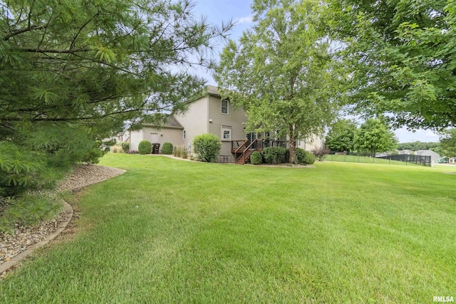 view of yard with stairway and fence