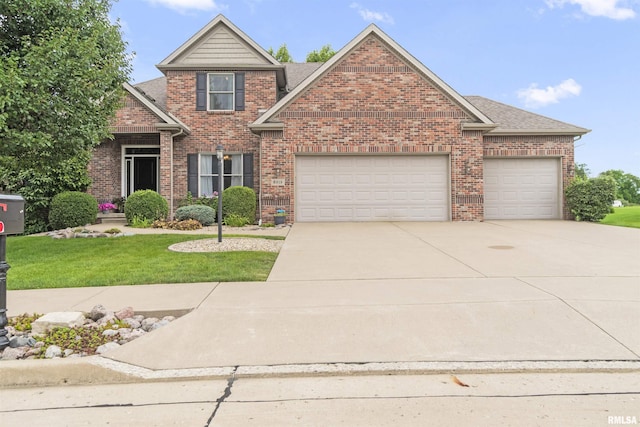 view of front of house featuring brick siding, roof with shingles, concrete driveway, a front yard, and a garage