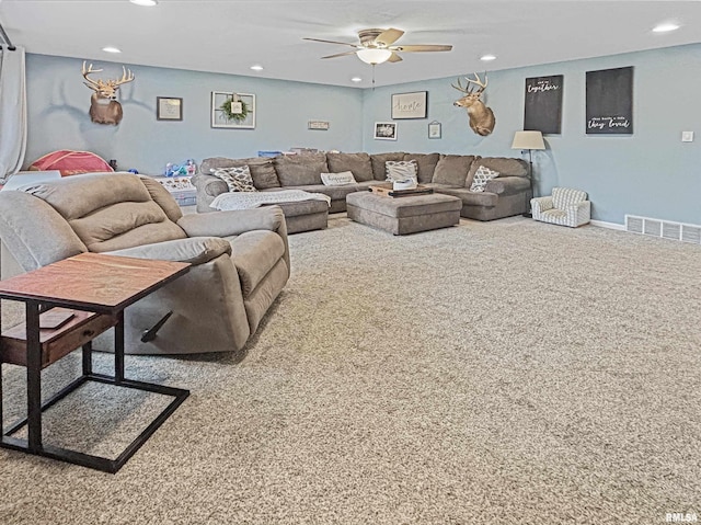 carpeted living area featuring baseboards, visible vents, a ceiling fan, and recessed lighting