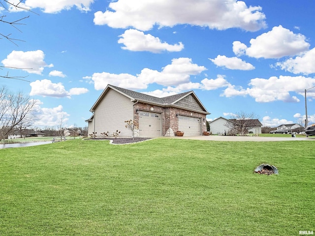 view of front of property featuring brick siding, an attached garage, concrete driveway, and a front yard