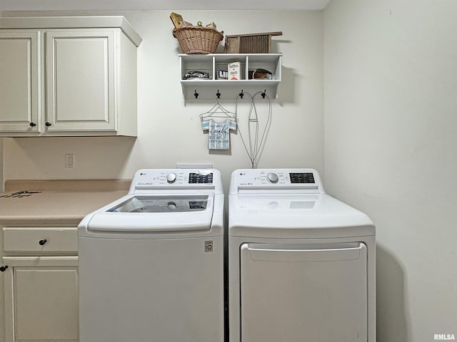 laundry area featuring cabinet space and washing machine and dryer