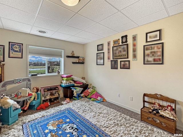 game room featuring a drop ceiling, baseboards, visible vents, and carpet floors