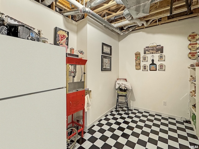 interior space featuring tile patterned floors and baseboards