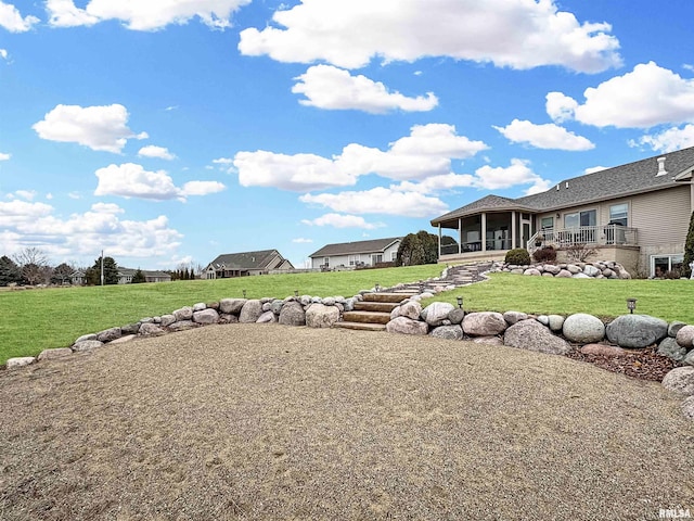 view of yard with a sunroom