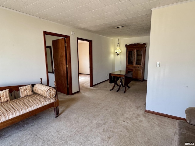 living room with light carpet, visible vents, and baseboards