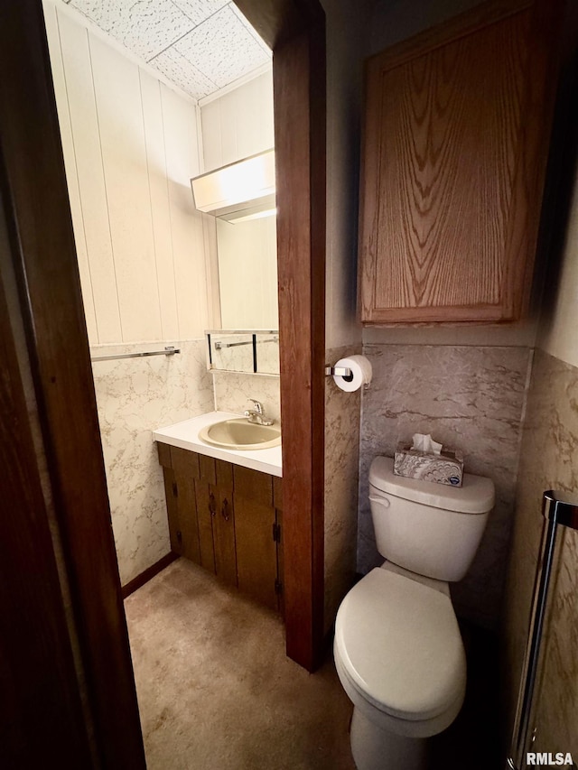 half bath with vanity and toilet