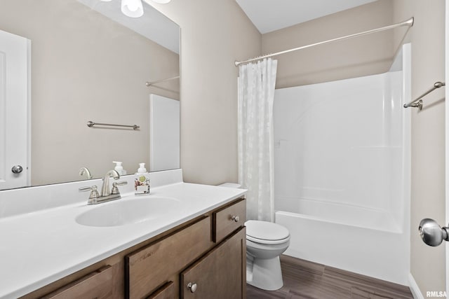 full bath featuring shower / tub combo, vanity, toilet, and wood finished floors