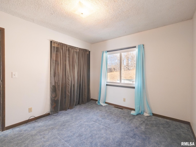 unfurnished bedroom featuring carpet floors, baseboards, and a textured ceiling