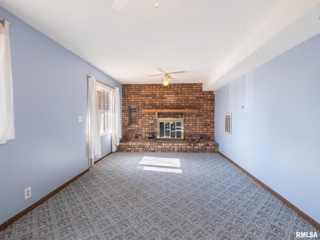 unfurnished living room featuring baseboards, carpet, a ceiling fan, and a brick fireplace