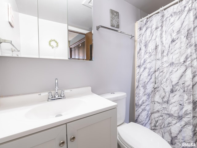 bathroom featuring toilet, a shower with curtain, and vanity