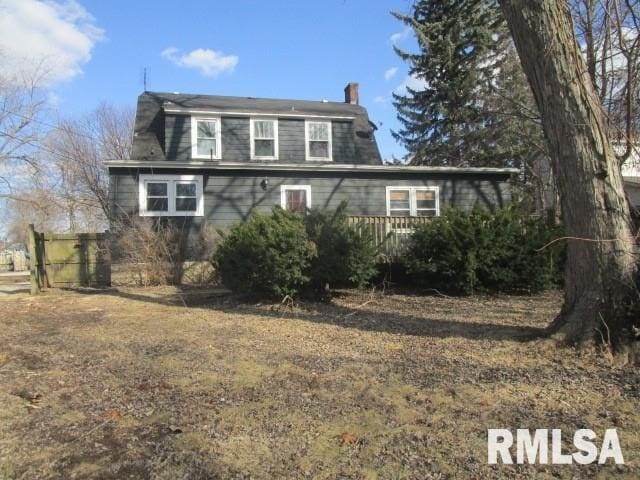 view of front of property featuring a chimney