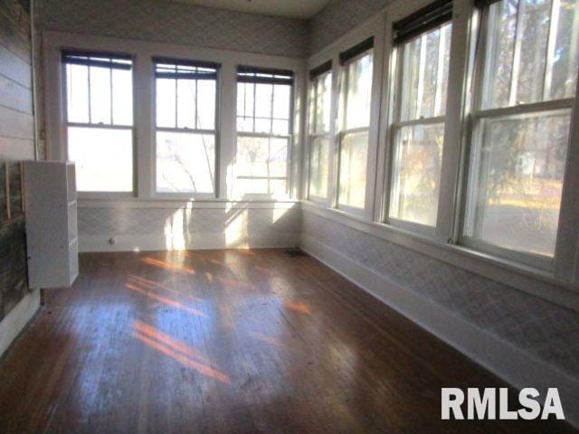 unfurnished sunroom with a healthy amount of sunlight