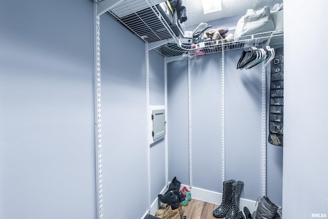 spacious closet with wood finished floors