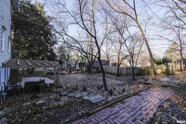 view of yard featuring a patio area, fence, and cooling unit