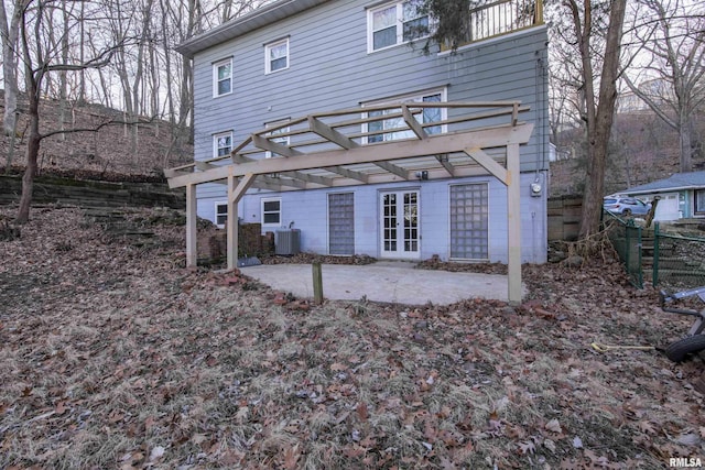 back of property featuring a patio area, fence, a pergola, and cooling unit